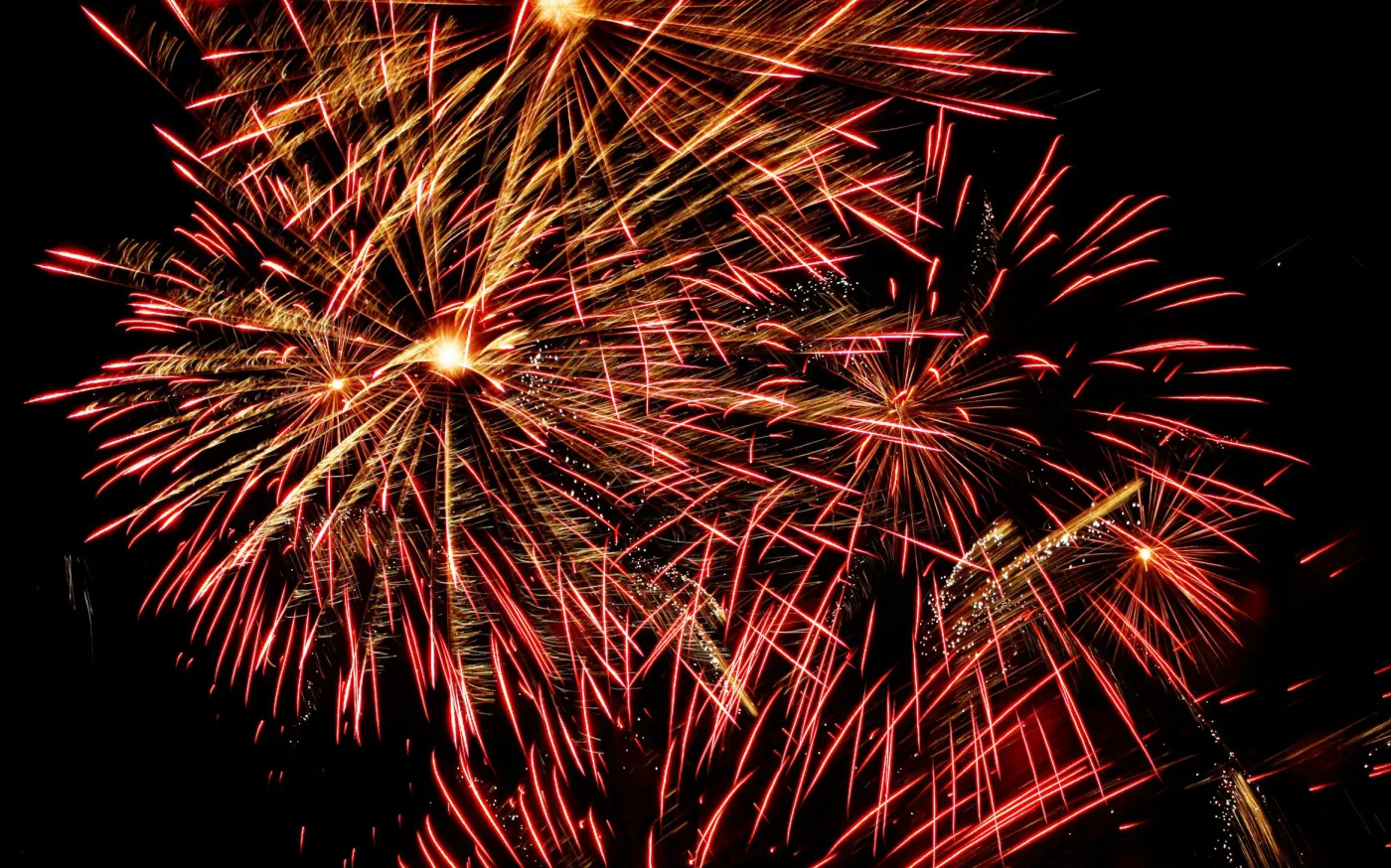 red fireworks by Paul Morley courtesy of Unsplash.