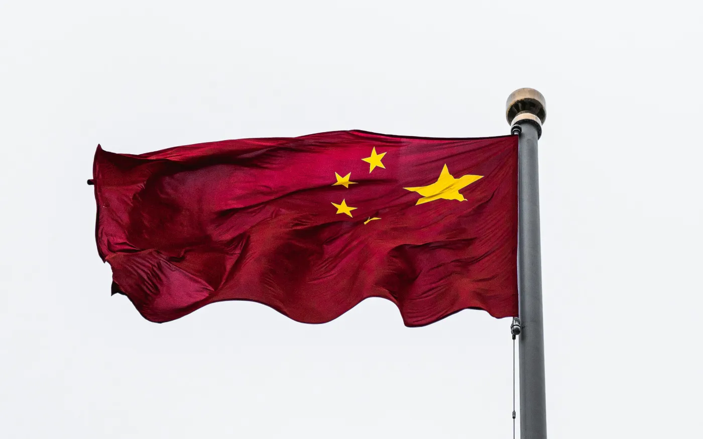 red national flag by Alejandro Luengo courtesy of Unsplash.