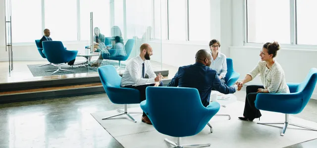 Financial advisors meeting in an office