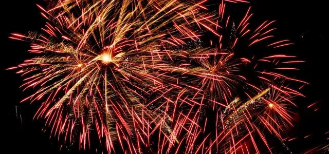red fireworks by Paul Morley courtesy of Unsplash.